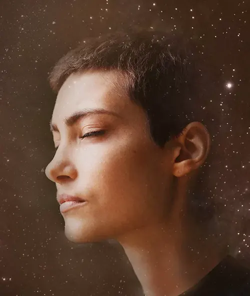Profile of a person against a starry background